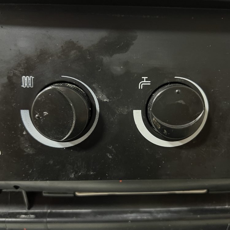 The dials on the front of a combi boiler control the hot water temperature and central heating temperature.